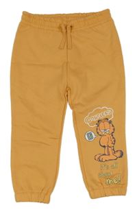 Oranžové tepláky s Garfieldem Primark