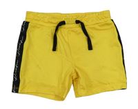 Žluté sportovní kraťasy s pruhem a logem River Island