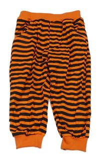 Oranžovo-čierne pruhované tepláky