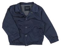 Tmavomodrá šušťáková jarná bunda Next