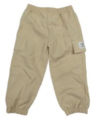 Béžové cargo šušťákové nohavice s nášivkou