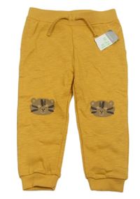 Nové - Hořčicové melírované tepláky s medvědy Primark