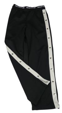 Černo-bílé sportovní kalhoty se cvočky Page one young