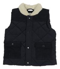 Tmavomodrá šusťákovo/manšestrová zateplená vesta Matalan