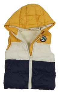 Hořčicovo-smetanovo-tmavomodrá šušťáková zateplená vesta s nášivkou a kapucňou Dunnes