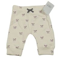 Nové - smetanové lehké tepláky s mašličkami George