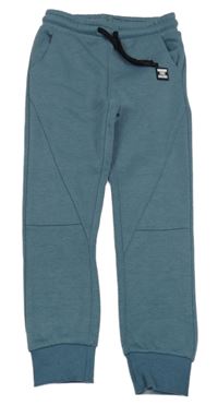 Modrošedé tepláky s nášivkou Dopodopo