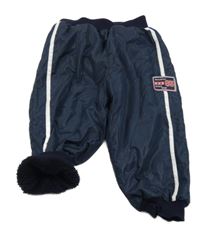 Tmavomodré šusťákové zateplené kalhoty s nášivkou 