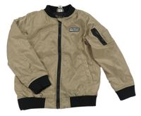 Pískovo-černý šusťákový zateplený bomber s nášivkou dopodopo