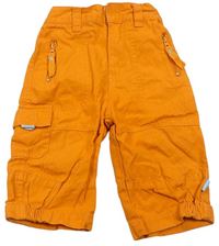 Oranžové plátenné nohavice