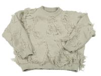 Béžový oversize sveter s strapcemi