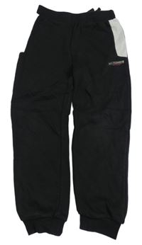 Čierno-svetlosivé tepláky s logom zn. MCKENZIE