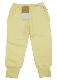 Nové - Žluté tepláky Name it