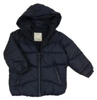 Tmavomodrá šusťáková prošívaná zimní bunda s kapucí Zara