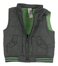 Tmavosivá šušťáková zateplená vesta M&Co.