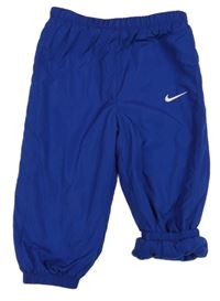 Zafírové šušťákové zateplené cuff nohavice s logom Nike
