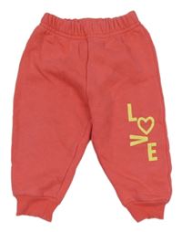 Korálové tepláky s nápisom