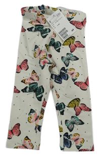 Smotanové tepláky s motýly H&M