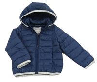 Tmavomodrá šusťáková prošívaná zimní bunda se stříbrnými lemy a kapucí Minioti