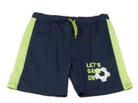 Tmavomodré športové kraťasy so zeleným pruhom a loptou