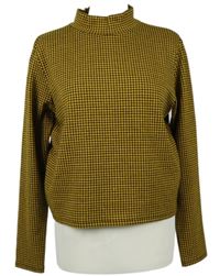 Dámské žluto-černé vzorované úpletové crop triko se stojáčkem Primark 