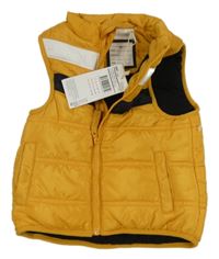 Nové - okrová šusťáková zateplená vesta orchestra 