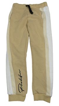 Béžovo-bílé tepláky s nápisem River Island