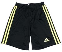 Černo-žluté sportovní kraťasy s pruhy a logem Adidas