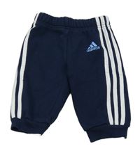 Tmavomodré tepláky s pruhy a logem Adidas