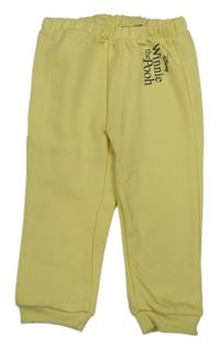 Žluté tepláky s nápisem - Pú Primark
