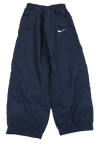 Tmavomodré šusťákové kalhoty Nike