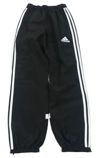 Čierno-biele šušťákové nohavice s logom Adidas