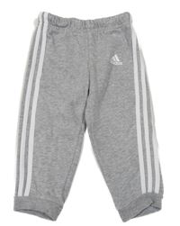 Šedo-bílé tepláky s pruhy a logem Adidas