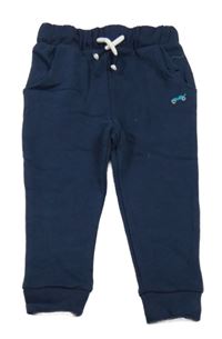 Tmavomodré tepláky s výšivkou Next