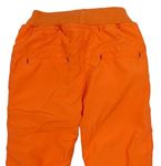 Oranžové šušťákové zateplené nohavice s nápisom zn. Ergee